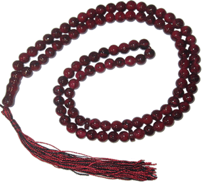 Tasbeeh prayer beads and the Noble Qur'an — symbols of dhikr and recitation during the blessed days of Dhul Hijjah